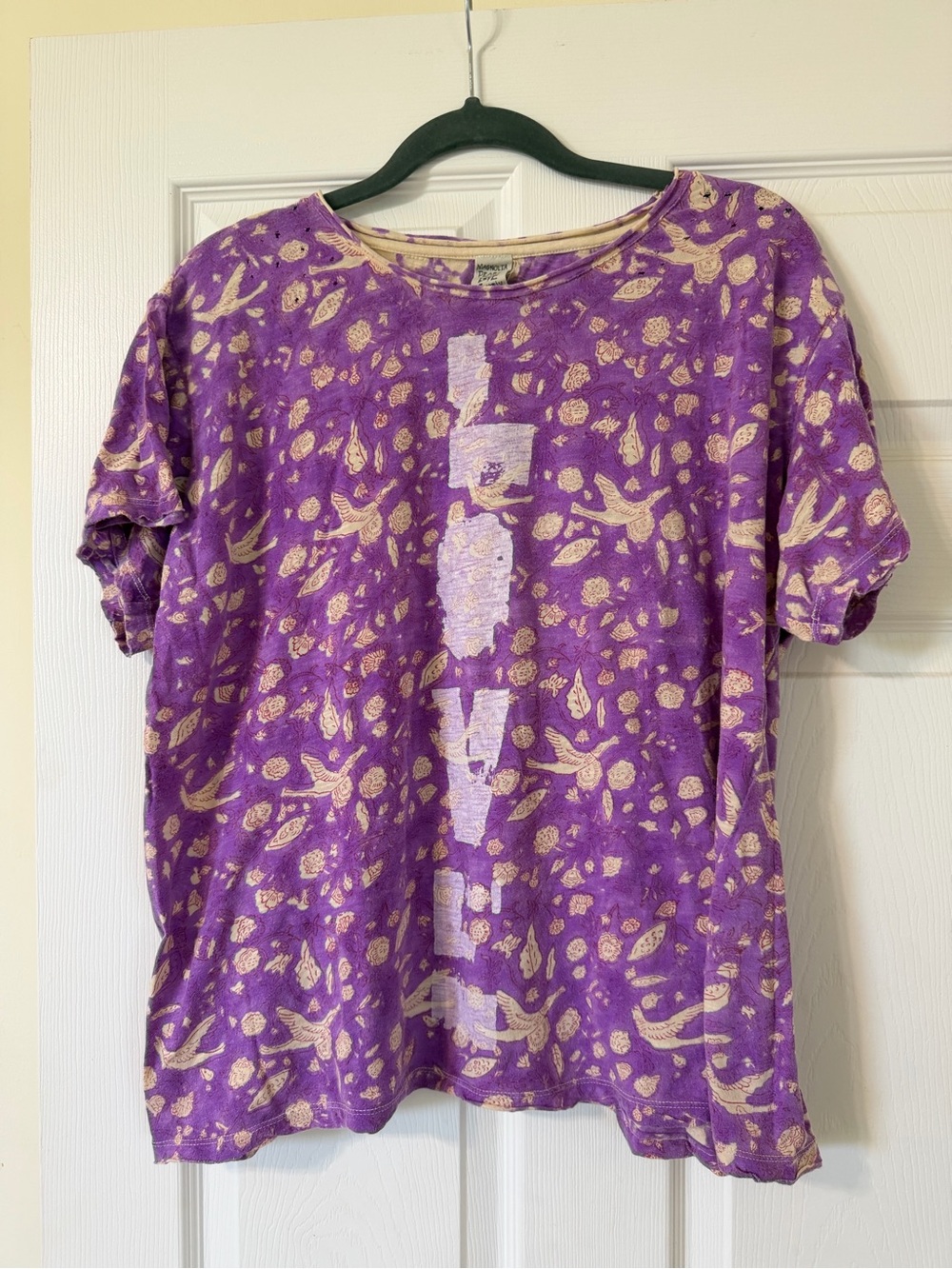 Magnolia Pearl distressed purple t-shirt featuring a "LOVE"